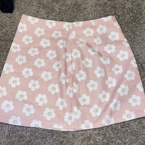 small pink skirt, with white flowers